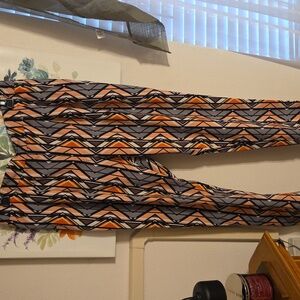 One Pair Of orange and gray geomatric pants size M $11.